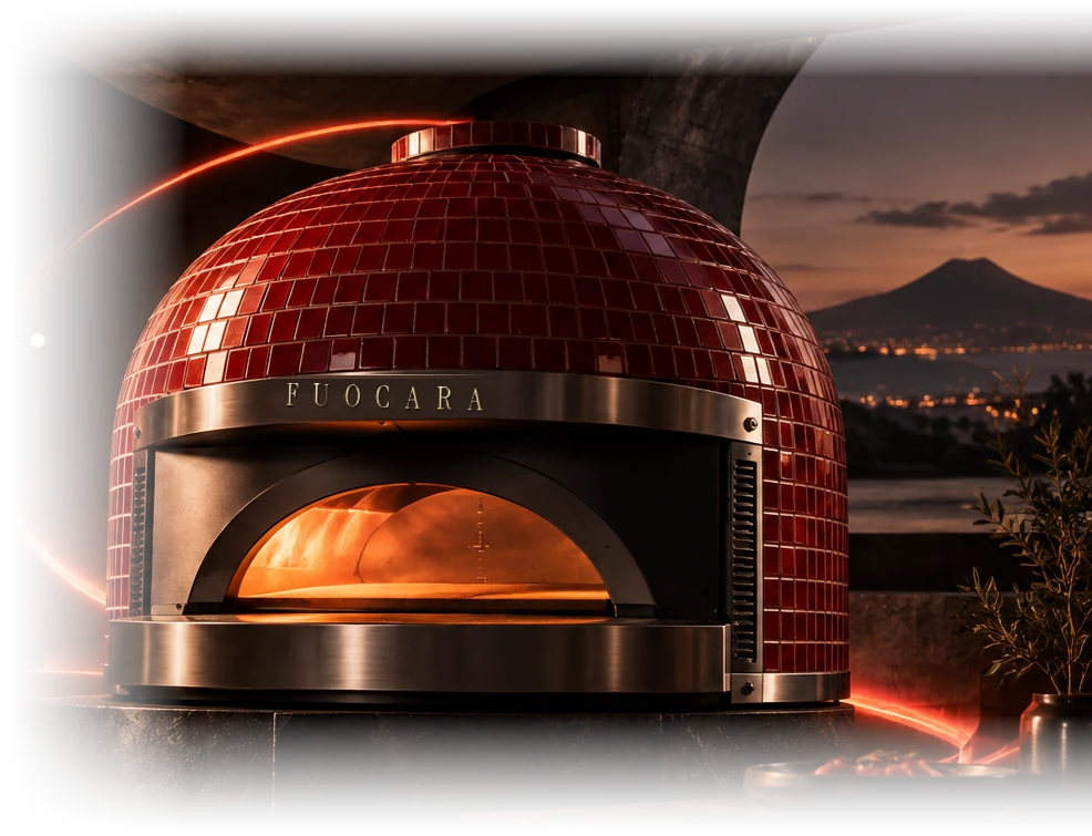 A FUOCARA oven with a red glazed-tile dome, its mouth glowing, on a terrace above the Bay of Naples at dusk